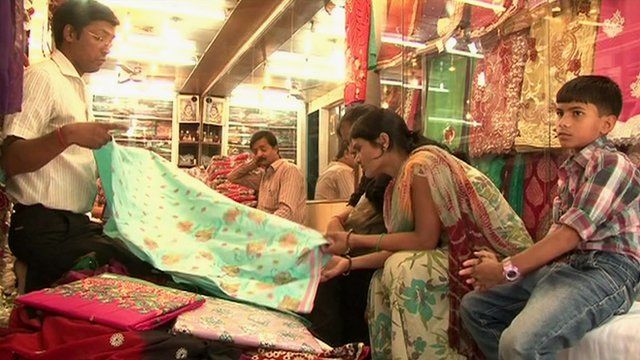 people looking at saris