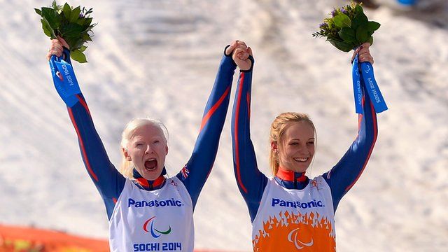 Gold medallists Kelly Gallagher (left) and guide Charlotte Evans after their women's Super-G triumph at the Paralympic Winter Games