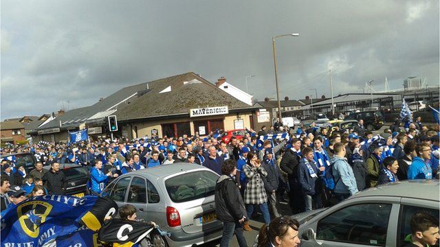 Thousands of Cardiff City fans march against club's blue to red rebrand -  BBC News