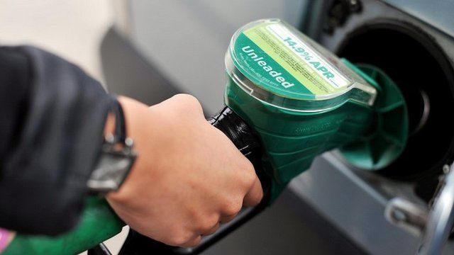 hand filling car with petrol