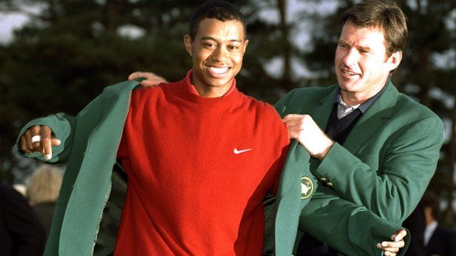 Tiger Woods receiving his first Masters jacket from Nick Faldo in 1997