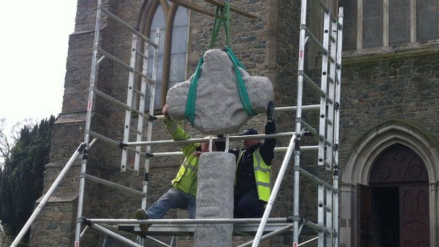 Almost there... The top of the High Cross is carefully set in place
