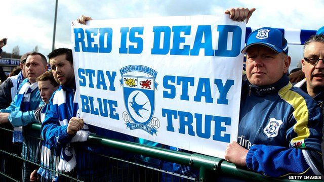 Thousands of Cardiff City fans march against club's blue to red rebrand -  BBC News