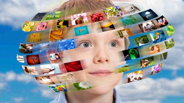 Boy with hundreds of digital images going around his head