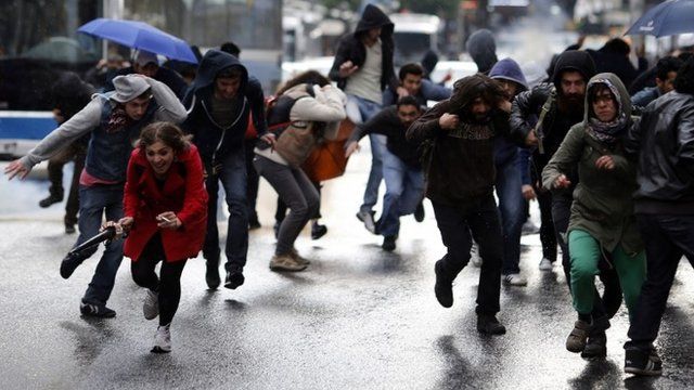 People run away from teargas