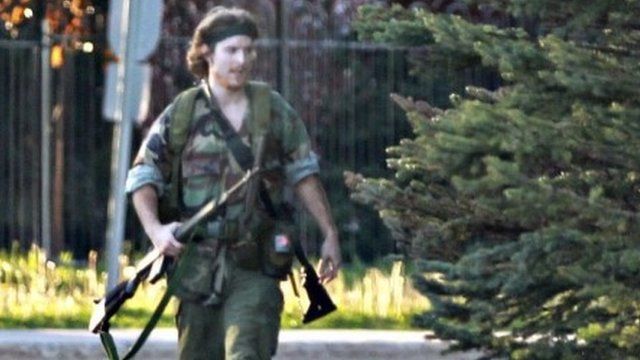 A heavily armed man that police have identified as Justin Bourque