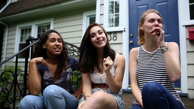 Girls sitting on a stoop