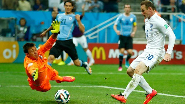 England's Wayne Rooney scores against Uruguay