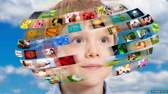 Boy with hundreds of digital images going around his head