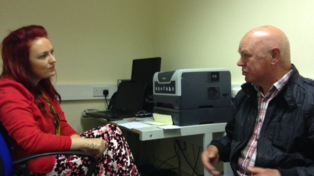 Citizens Advice worker helping patient at GP surgery