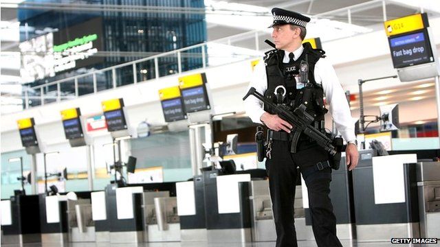 Armed police officers patrol the new Terminal 5 at Heathrow Airport