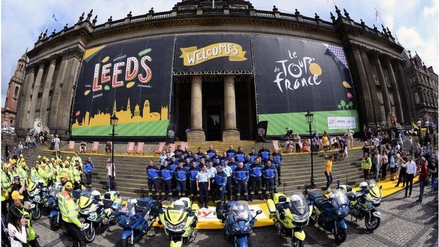 French Republican Guards, working on Tour de France security, pose for a family picture in front of the city hall of Leeds, northern England, on July 4, 2014