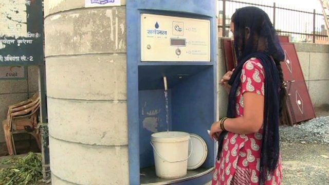 Woman at water ATM