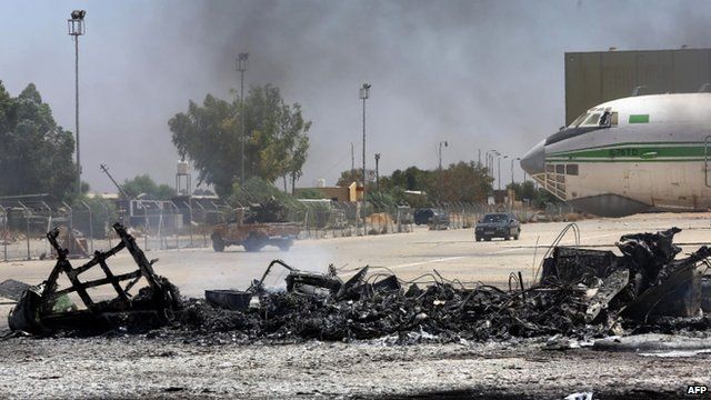 The remains of a burnt airplane at the Tripoli international airport in the Libyan capital on 16 July 2014.