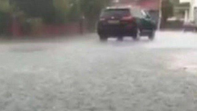Car in flooded road