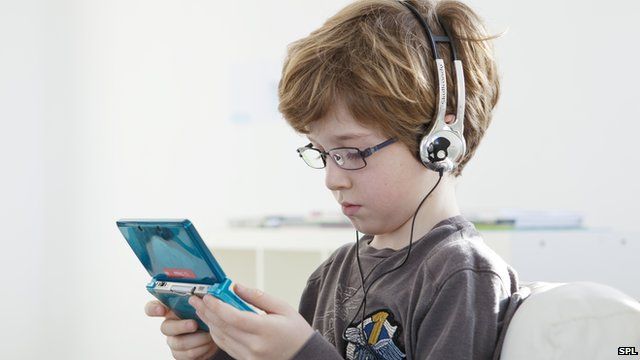 Child playing shop video games