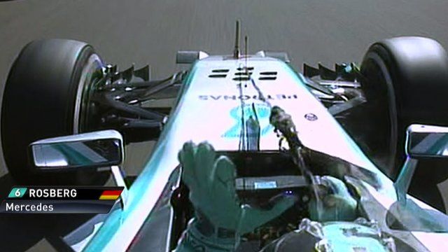 Mercedes' Nico Rosberg removes debris