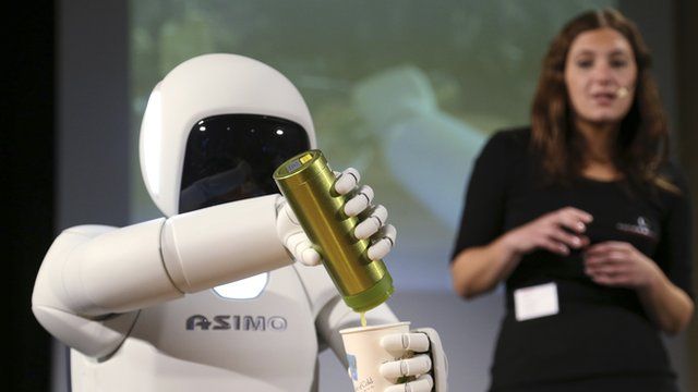 Honda's Asimo humanoid robot pours a drink into a cup