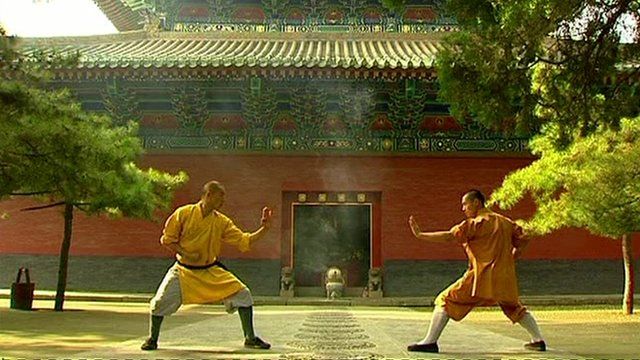 Two monks at Shaolin Buddhist Temple doing Kung Fu