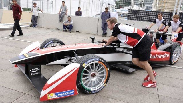Engineers prepare for the upcoming Formula E Championship race on Saturday in Beijing