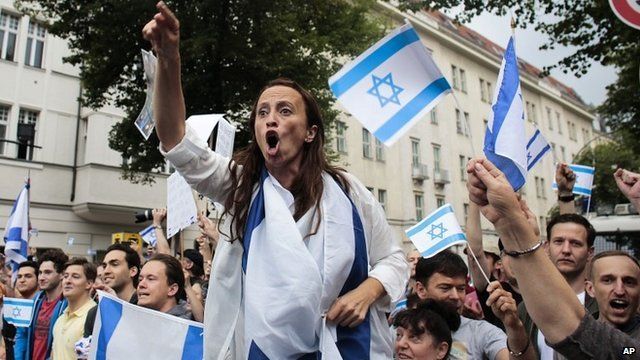Pro-Israel demonstrators shout slogans at pro-Palestinian protesters in Berlin - 25 July 2014