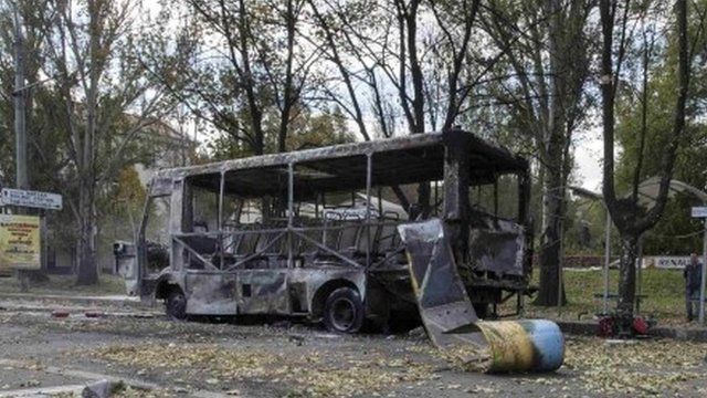 A mini-bus damaged in the shelling