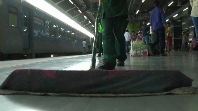Broom sweeping railway platform