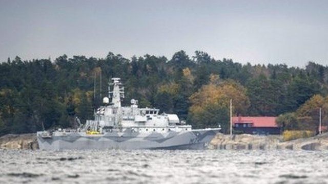 A Swedish minesweeper and guard boat searching for the mystery vessel