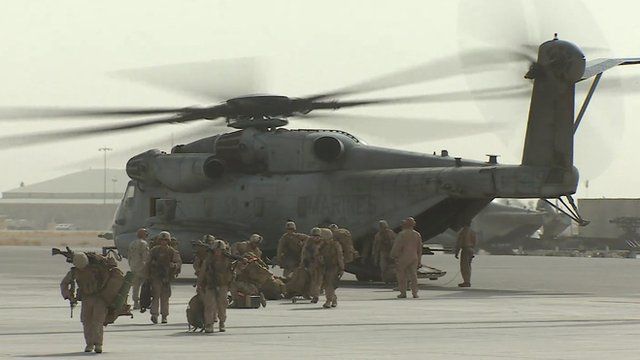 Troops and helicopter