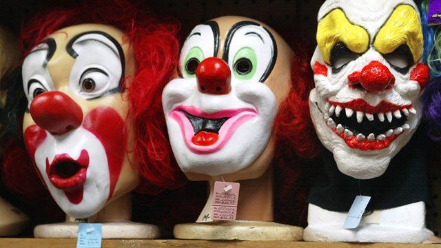 Clown masks displayed at a costume store