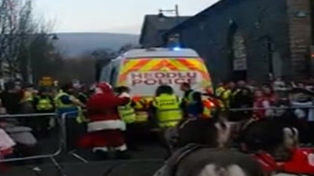 Santa leaves Christmas parade in the back of a police van in Aberdare, Cynon Valley