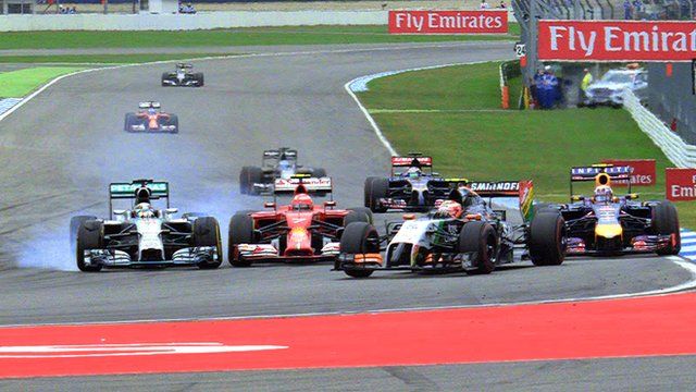 Lewis Hamilton passes Kimi Raikkonen and Daniel Ricciardo during the German Grand Prix