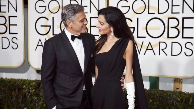 Actor George Clooney and wife, Amal Clooney, arrive at the 72nd Golden Globe Awards in Beverly Hills, California January 11, 2015