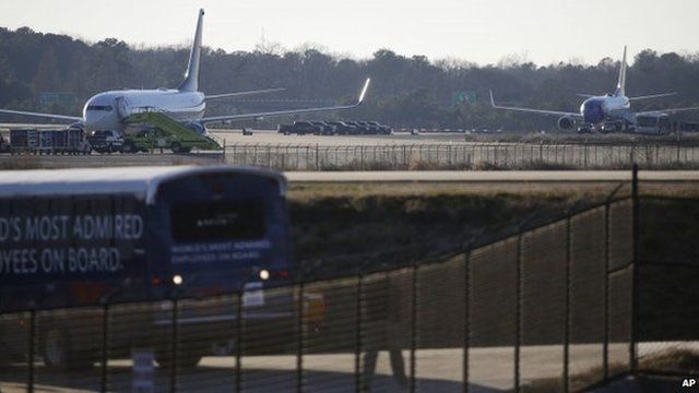 A Delta plane (left) and a Southwest flight sit on the tarmac at Atlanta's Hartsfield-Jackson International Airport. Photo: 24 January 2015