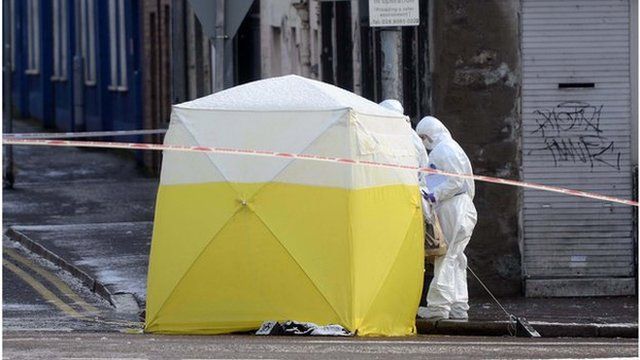 One man has been arrested after a man's body was found at Botanic Avenue in Belfast