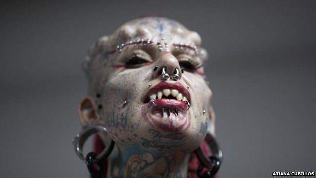 Mary Jose Cristerna, a Mexican known as The Vampire Woman, poses for the public to take portraits of her during the annual Venezuela Tattoo International Expo in Caracas, Venezuela