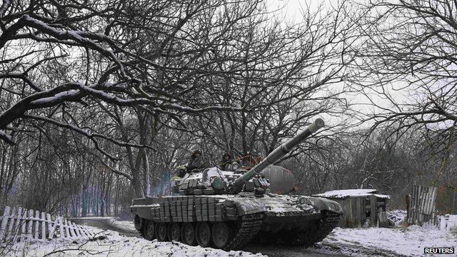 Pro-Russian separatists ride on a tank outside the town of Horlivka, eastern Ukraine 10 February 2015