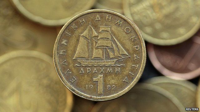A drachma coin is seen on display in this photo illustration taken in Athens in this May 9, 2012 file photo