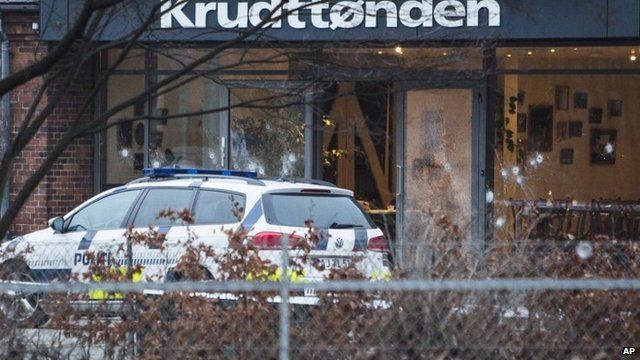 Copenhagen cafe, with bullet-marked windows, where a gunman opened fire
