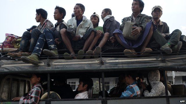 Residents who fled from conflict areas near the Myanmar and Chinese border arrive at a temporary refugee camp at a monastery in Lashio, northern Myanmar on 19 February 2015