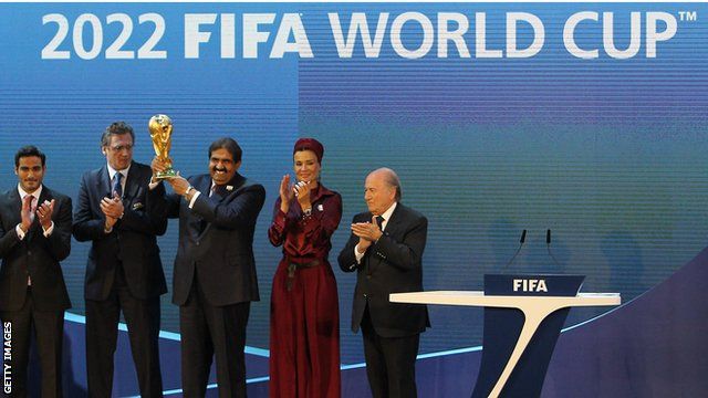 FIFA president Sepp Blatter awards Qatari officials the World Cup for 2022