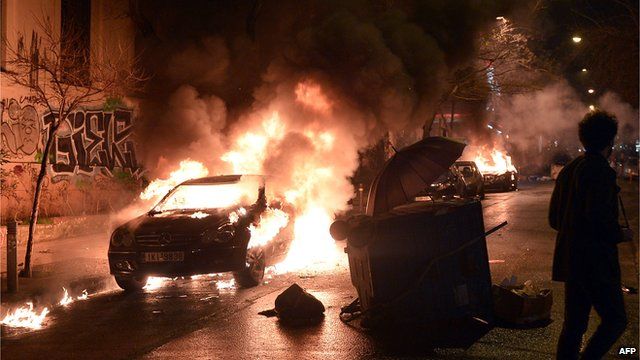 A burning car in central Athens' Exarchia district on 26 February 2015