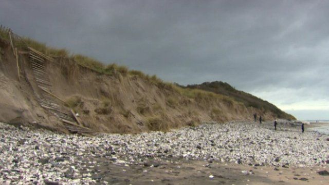 The RNLI has warned the public to stay away from the sand cliff edges and bases, as Andy West reports