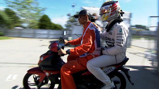 Lewis Hamilton hitches a ride back to the pits