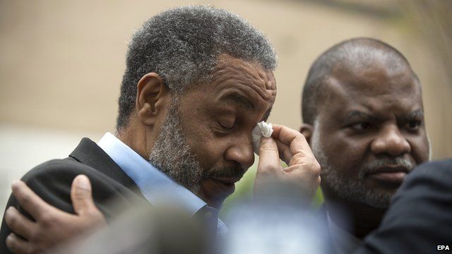 Anthony Ray Hinton wipes tears from his eyes after being released