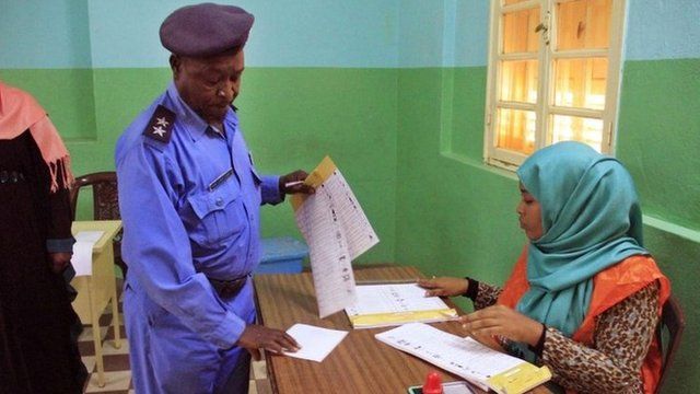 A Sudanese man casts his vote