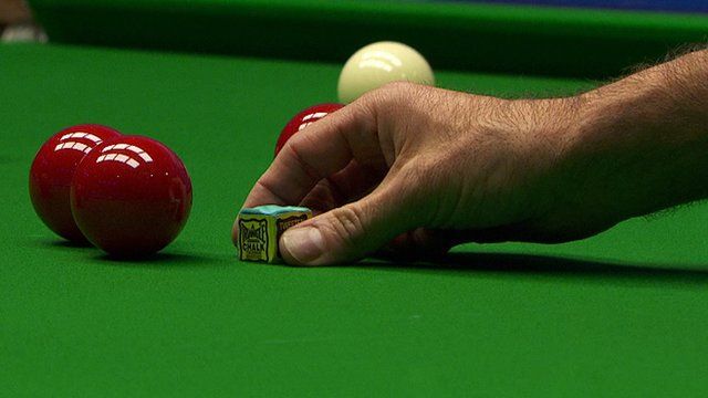 Ronnie O'Sullivan places the chalk on the table at the World Snooker Championship