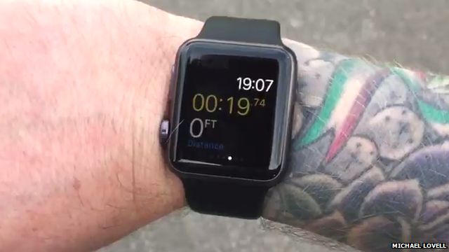 Apple Watch on a tattooed wrist