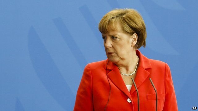 German Chancellor Angela Merkel looking right