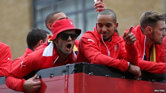 Arsenal's Jack Wilshere and Theo Walcott celebrate